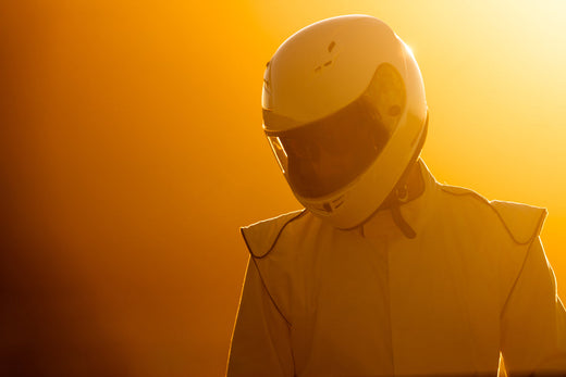 f1-driver-in-helmet-and-suit